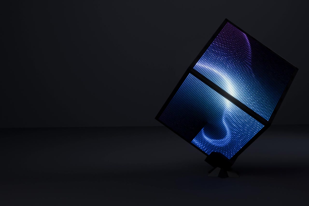 Lucent Cube, a six-faced LED matrix cube glowing with blue light on its stand